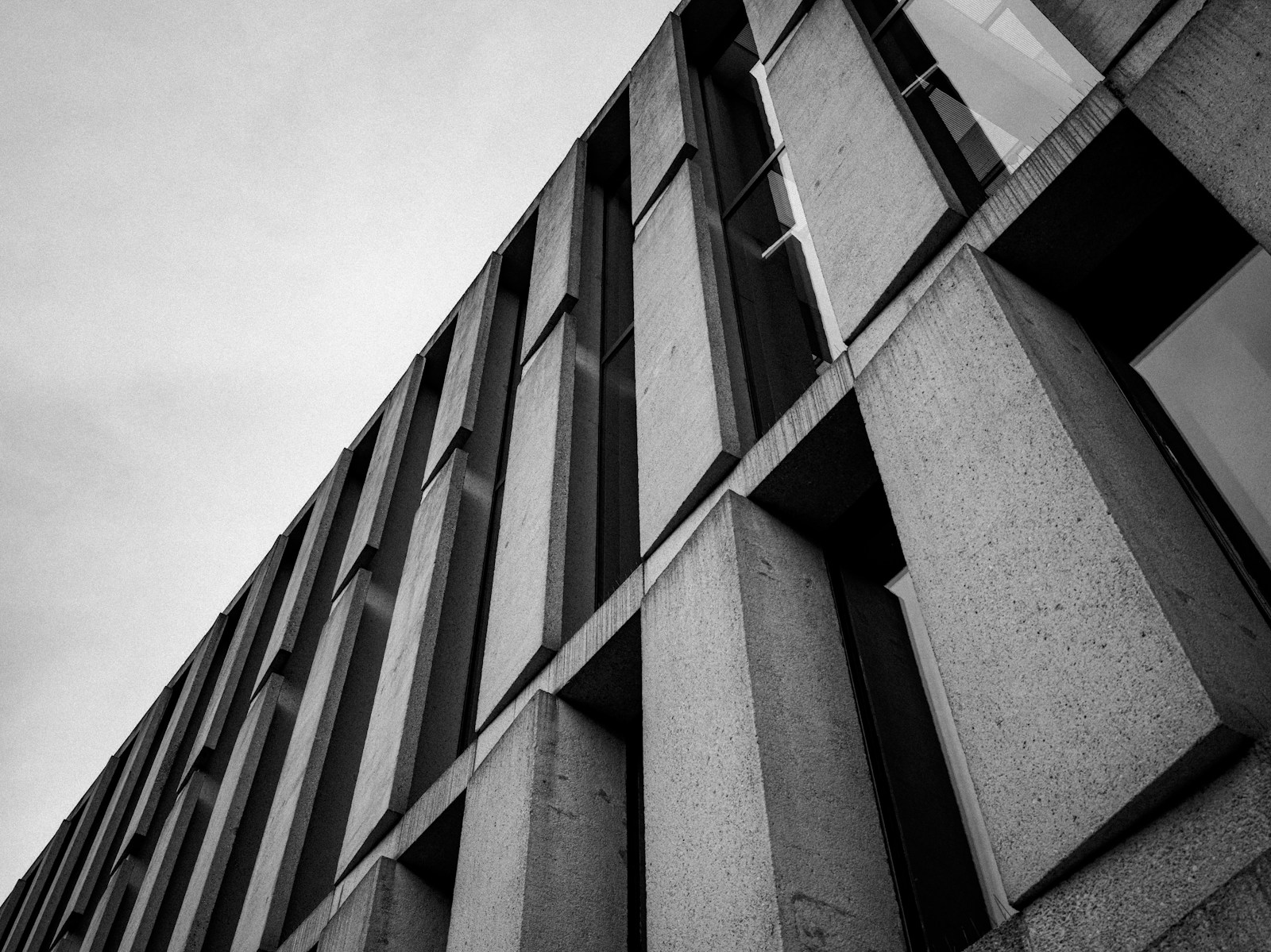 A close-up architectural study of concrete structure and light